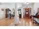 Elegant foyer with hardwood floors and a dining area showcasing detailed trim and natural light at 811 Weeping Willow Dr, Powder Springs, GA 30127