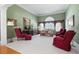 Comfortable living room with plush seating, a large window, and bright, neutral-toned walls at 811 Weeping Willow Dr, Powder Springs, GA 30127