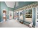 Sun-filled room with large windows providing serene outdoor views and natural light at 811 Weeping Willow Dr, Powder Springs, GA 30127
