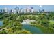 Aerial view of Piedmont Park with pool, Atlanta skyline and surrounding trees at 1029 Piedmont Ne Ave # 101, Atlanta, GA 30309