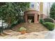 Inviting entrance to Piedmont Park West with stone steps and beautiful landscaping at 1029 Piedmont Ne Ave # 101, Atlanta, GA 30309