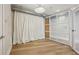 Flex room with frosted glass sliding doors and light wood flooring at 1029 Piedmont Ne Ave # 101, Atlanta, GA 30309