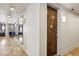 Hallway with travertine floors, mirrors, and a wooden door with room number 101 at 1029 Piedmont Ne Ave # 101, Atlanta, GA 30309