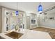 Kitchen island featuring stainless steel sink and faucet with view of the living room at 1029 Piedmont Ne Ave # 101, Atlanta, GA 30309