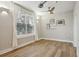 Living room with bright window, ceiling fan and floating shelves at 1029 Piedmont Ne Ave # 101, Atlanta, GA 30309