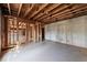 Unfinished basement shows exposed ceiling, framed walls, and concrete floor at 3128 Lower Roswell Rd, Marietta, GA 30068