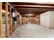 Unfinished basement includes exposed ceiling beams and concrete floors at 3128 Lower Roswell Rd, Marietta, GA 30068