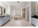 Bright bathroom featuring dual vanities, a soaking tub, and a stand alone shower at 3128 Lower Roswell Rd, Marietta, GA 30068