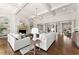 Spacious living room featuring a stone fireplace, built-in shelves and dark hardwood floors at 3128 Lower Roswell Rd, Marietta, GA 30068