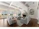 Spacious living room with coffered ceiling, fireplace, built-ins, and abundant natural light at 3128 Lower Roswell Rd, Marietta, GA 30068