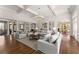 Bright, open living room with hardwood floors, a coffered ceiling, and a round chandelier at 3128 Lower Roswell Rd, Marietta, GA 30068