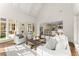 Bright living room featuring hardwood floors, neutral paint, with view to an eat-in kitchen at 3128 Lower Roswell Rd, Marietta, GA 30068