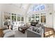 Bright living room featuring hardwood floors, a vaulted ceiling, and large windows at 3128 Lower Roswell Rd, Marietta, GA 30068