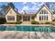 Gorgeous swimming pool reflects the home's architectural details, including its many windows and covered patio at 3128 Lower Roswell Rd, Marietta, GA 30068