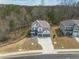 Beautiful aerial view of a two-story home with a two-car garage in a lovely neighborhood setting at 372 Garnet Dr, Acworth, GA 30101