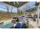 Inviting covered back porch with outdoor seating and a fireplace, perfect for entertaining in the backyard at 372 Garnet Dr, Acworth, GA 30101