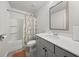 Bathroom with a shower/tub combo, gray vanity, white countertop and a colorful shower curtain at 372 Garnet Dr, Acworth, GA 30101