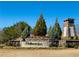 Community entrance featuring stone signage, landscaping and flowers at 372 Garnet Dr, Acworth, GA 30101