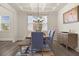 Bright dining room with modern chandelier and large window at 372 Garnet Dr, Acworth, GA 30101