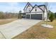 Charming two-story home featuring a two-car garage and well-manicured lawn at 372 Garnet Dr, Acworth, GA 30101