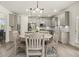 Open kitchen and dining area with modern lighting and stainless appliances at 372 Garnet Dr, Acworth, GA 30101