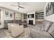 Bright living room featuring two sofas, a ceiling fan, and a fireplace at 372 Garnet Dr, Acworth, GA 30101