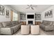 Spacious living room with fireplace, built-in shelving, and comfortable seating at 372 Garnet Dr, Acworth, GA 30101