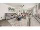 Bright living room with sofas, chairs, and a view of the kitchen at 372 Garnet Dr, Acworth, GA 30101