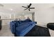 Cozy upstairs living room with plush blue sectional sofa and ample space for relaxation and entertainment at 372 Garnet Dr, Acworth, GA 30101
