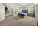 Spacious main bedroom with tray ceilings, carpet, and views to the ensuite bathroom at 372 Garnet Dr, Acworth, GA 30101