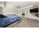Main bedroom featuring tray ceilings, carpet, and views to the ensuite bathroom and entry at 372 Garnet Dr, Acworth, GA 30101