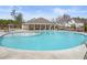 Community pool with lounge chairs, umbrellas, a shallow splash area, and clubhouse at 372 Garnet Dr, Acworth, GA 30101