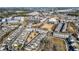 Wide aerial shot of a residential area highlighting dense housing, green spaces, and community pond at 3862 Memphis Dr, Suwanee, GA 30024