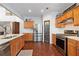 Well lit kitchen with hardwood floors and stainless steel appliances at 3862 Memphis Dr, Suwanee, GA 30024