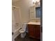 This bathroom features a tub shower, vanity and medicine cabinet at 504 Harbor Lake Ct, Marietta, GA 30066