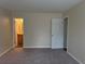 The neutral bedroom has an ensuite bathroom at 504 Harbor Lake Ct, Marietta, GA 30066