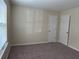 Neutral bedroom features cozy carpeting and natural light from a large window at 504 Harbor Lake Ct, Marietta, GA 30066