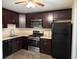 Modern kitchen featuring dark cabinetry, stainless steel appliances and ample counter space at 504 Harbor Lake Ct, Marietta, GA 30066