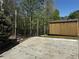 Landscaped backyard with a new shed, string lights, and patio area at 101 Flagler Way, Dallas, GA 30157