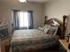 Cozy bedroom featuring a bed with decorative pillows and a ceiling fan at 101 Flagler Way, Dallas, GA 30157