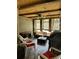 Bright sunroom featuring a comfortable seating area and wood-paneled ceiling at 101 Flagler Way, Dallas, GA 30157
