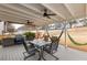 Covered back patio features an outdoor dining area, a barbecue, and a large yard at 1445 Wheatfield Dr, Lawrenceville, GA 30043