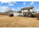 Large backyard featuring a covered patio, hammocks, and outdoor grill at 1445 Wheatfield Dr, Lawrenceville, GA 30043