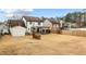 Extensive backyard featuring a hot tub, covered patio, hammocks, and outdoor grill at 1445 Wheatfield Dr, Lawrenceville, GA 30043