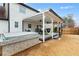 A hot tub and covered patio with hammocks enhance this home's backyard at 1445 Wheatfield Dr, Lawrenceville, GA 30043