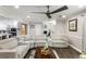 Open-concept living room with a large sectional, hardwood floors, and a seamless flow to the kitchen at 1445 Wheatfield Dr, Lawrenceville, GA 30043