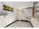 A full basement with black painted baseboards and two window views at 2020 Wilandrew Dr, Decatur, GA 30033