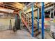 Basement with utility hook-ups, painted staircase, and storage at 2020 Wilandrew Dr, Decatur, GA 30033