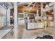 Unfinished basement with exposed beams, concrete floors, and storage shelves at 2020 Wilandrew Dr, Decatur, GA 30033