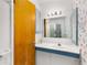 Bathroom features sink, mirror, and colorful wallpaper at 2020 Wilandrew Dr, Decatur, GA 30033